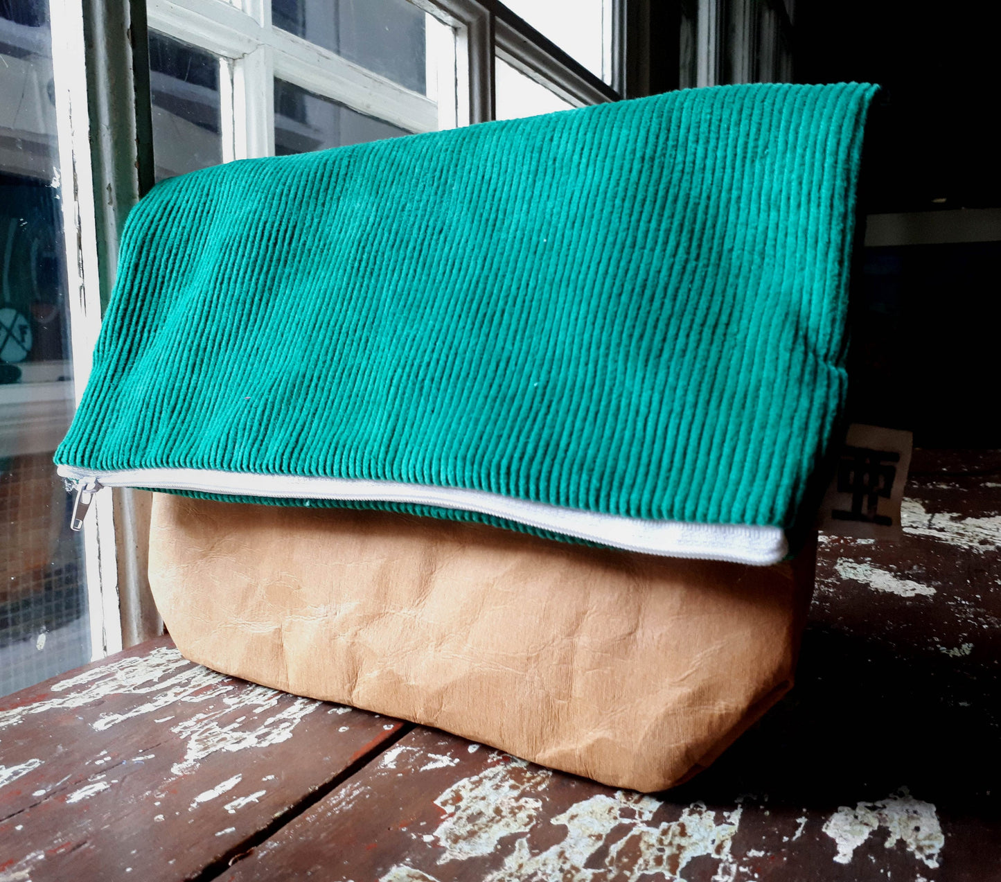 Fold over clutch bag made from washable kraft paper