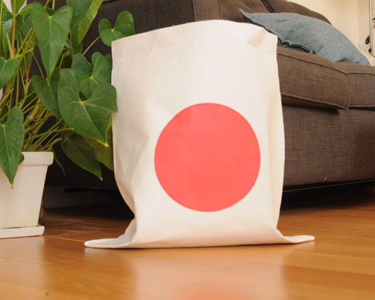 Paper bag storage with big red dot made from washable paper