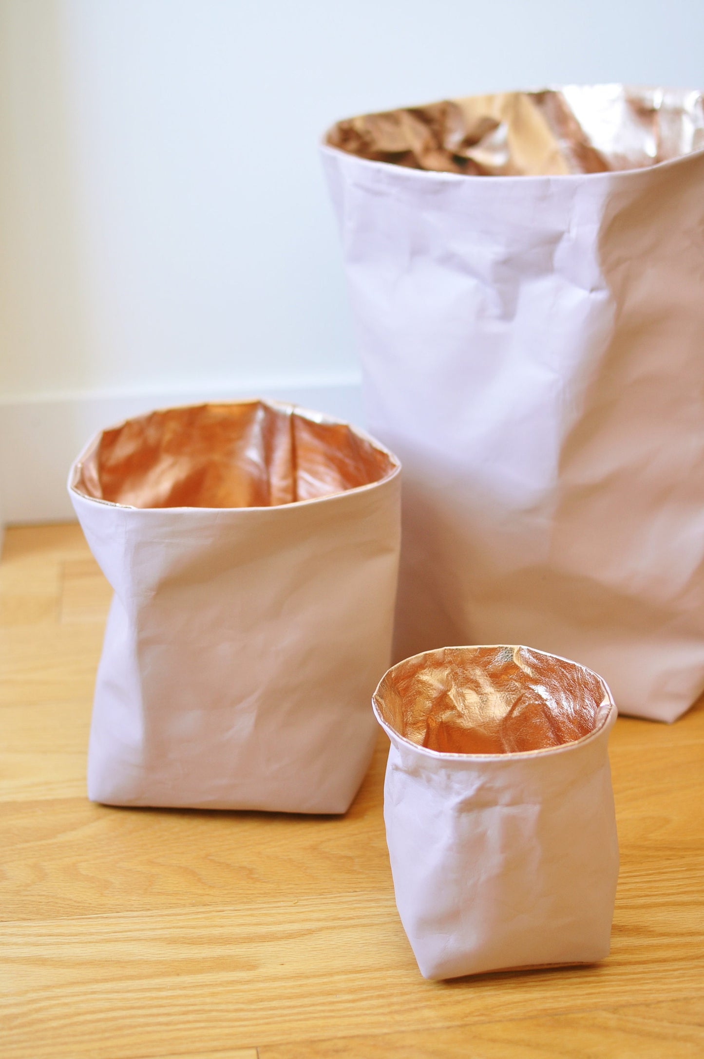 PINK + ROSE GOLD paper bag storage made from washable, reusable and recycled paper. Vegan Leather magazine holder for your living room