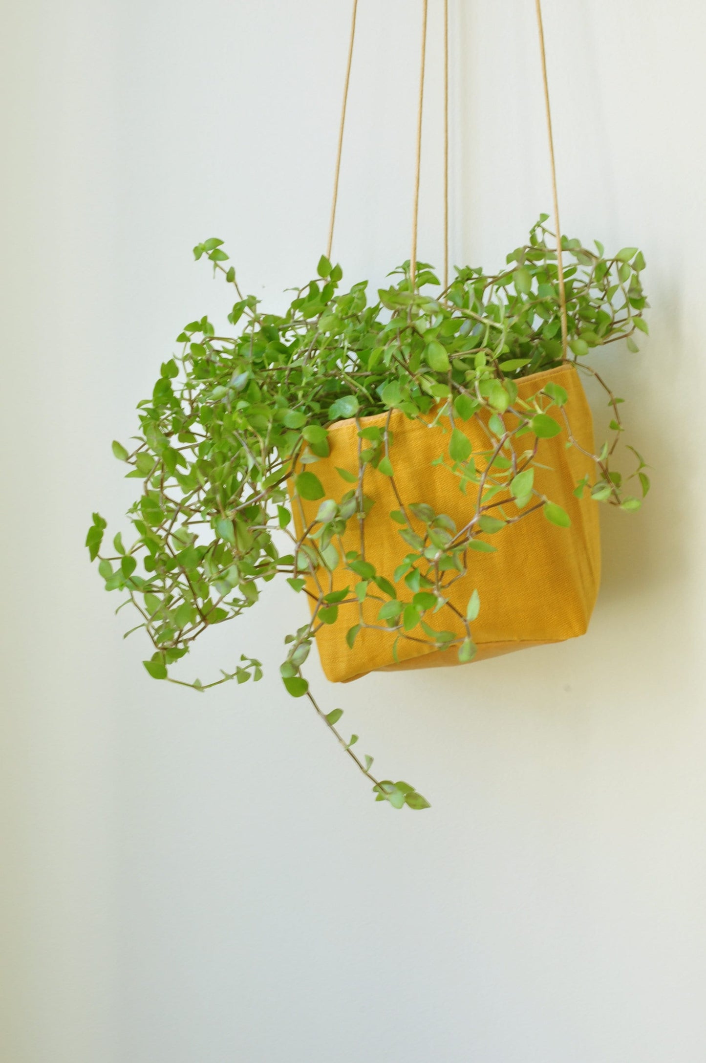 Planter, hanging paper planter made from washable reusable paper and Linen in yellow and pink beige. Vegan Leather planter for living room