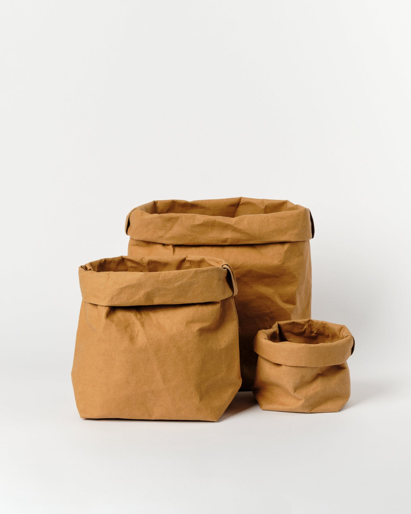 Brown Paper bag storage made from washable, reusable and recycled paper. Vegan Leather brown bag for your home