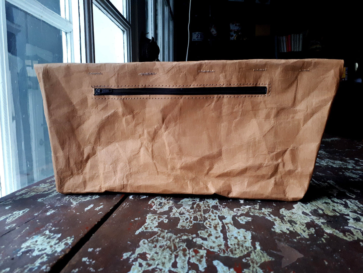 Fold over purse made from washable and reusable brown kraft paper